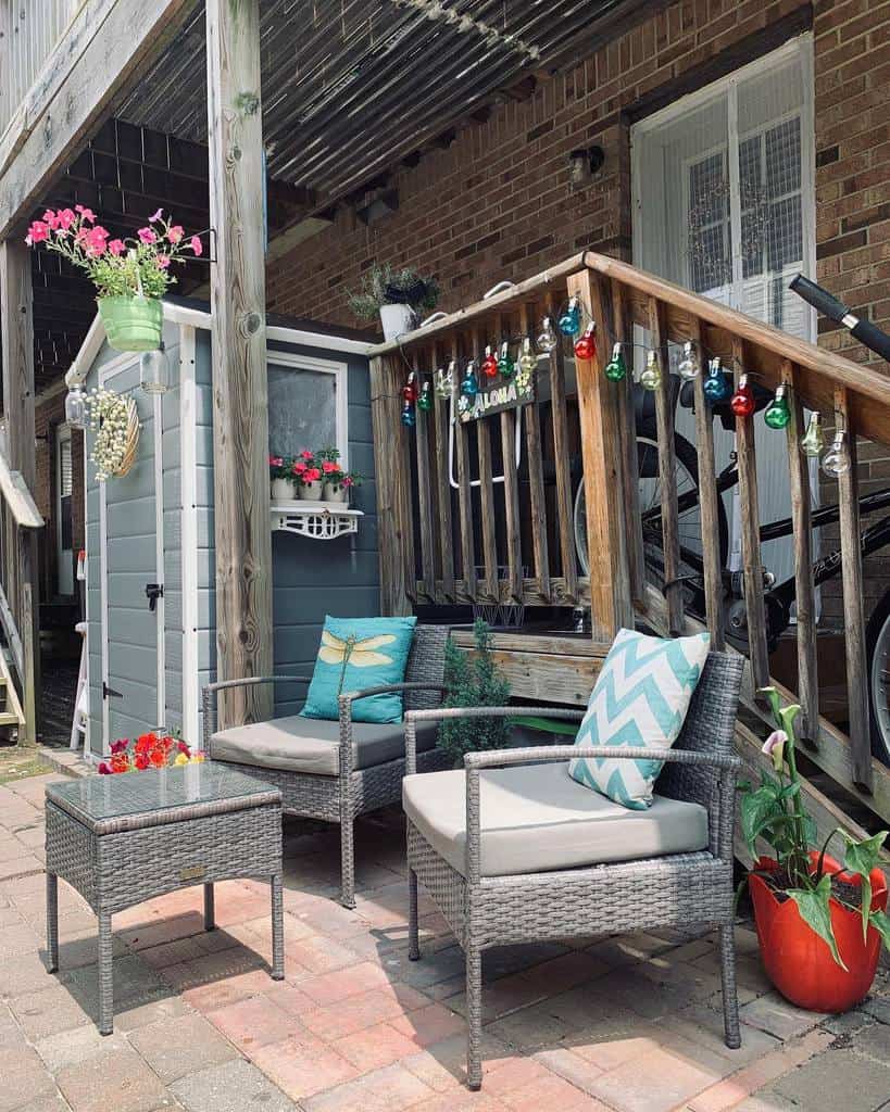 small paver patio with wicker furniture