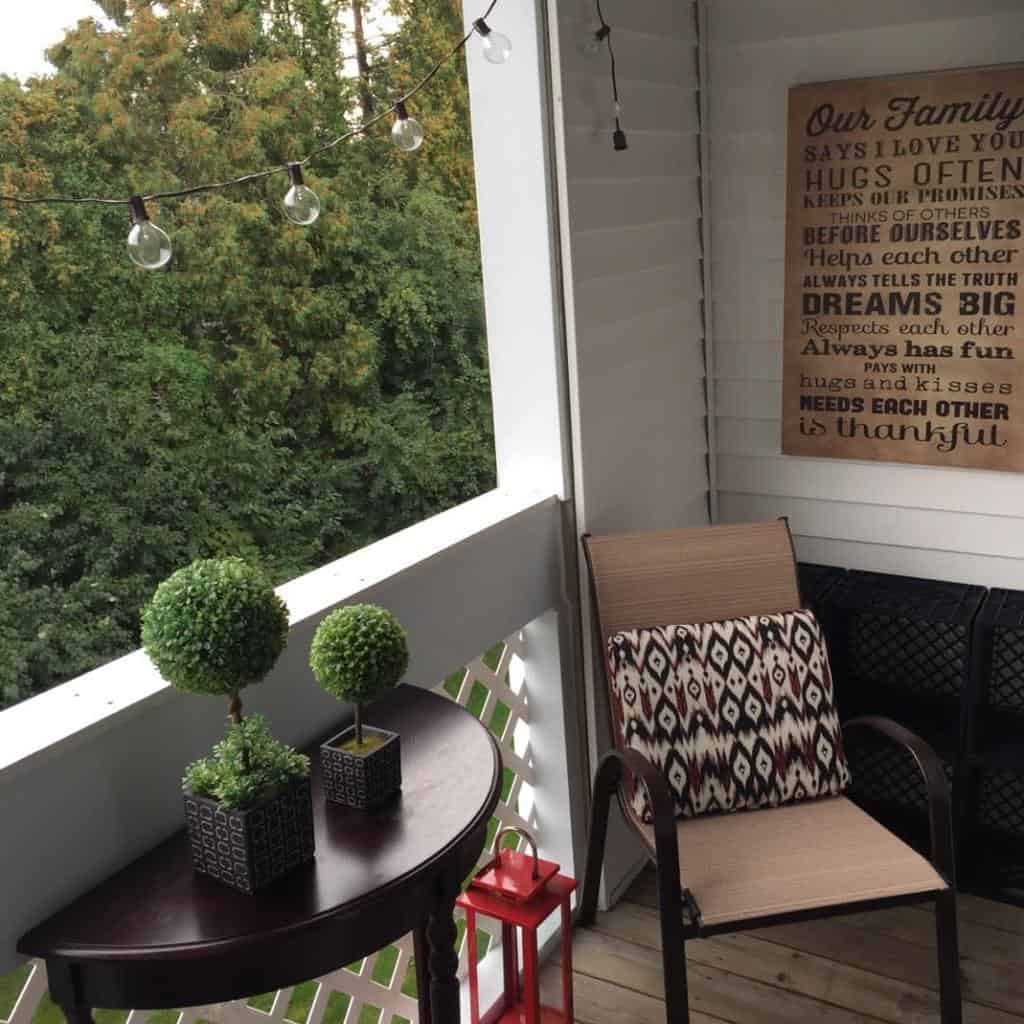 small enclosed patio with table and chair