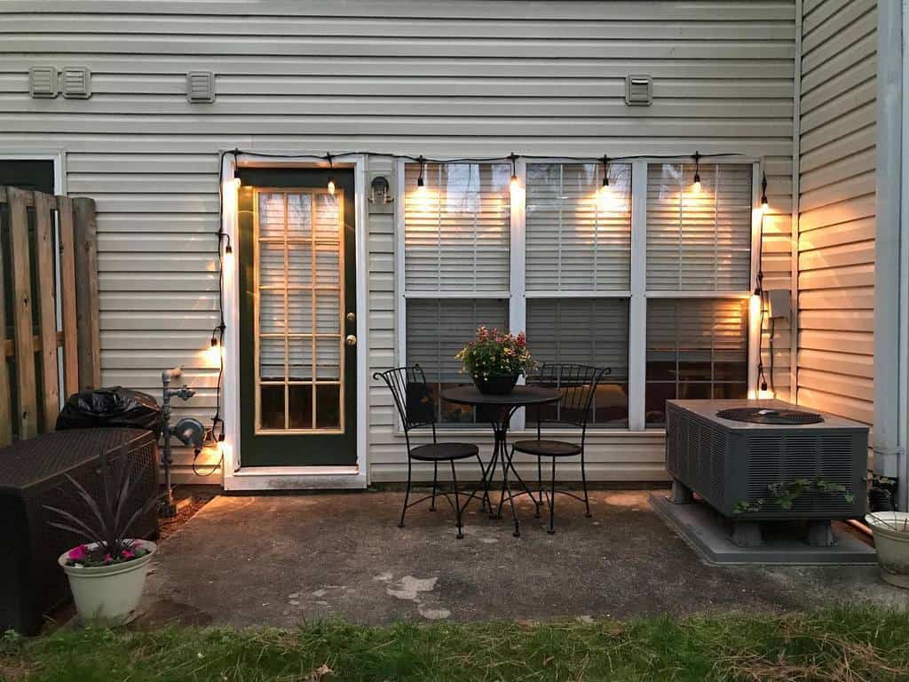 small backyard patio with string lights