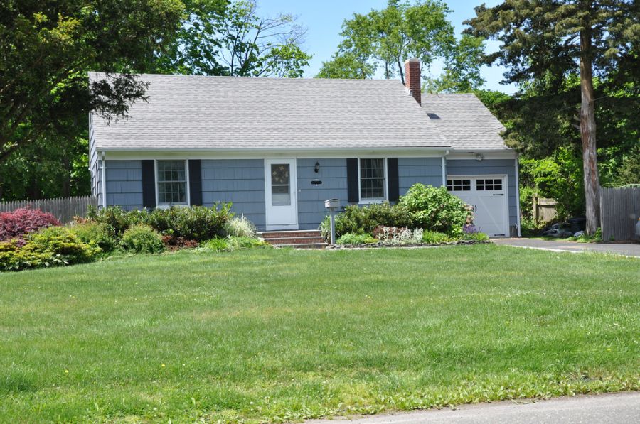 large front lawn blue american home