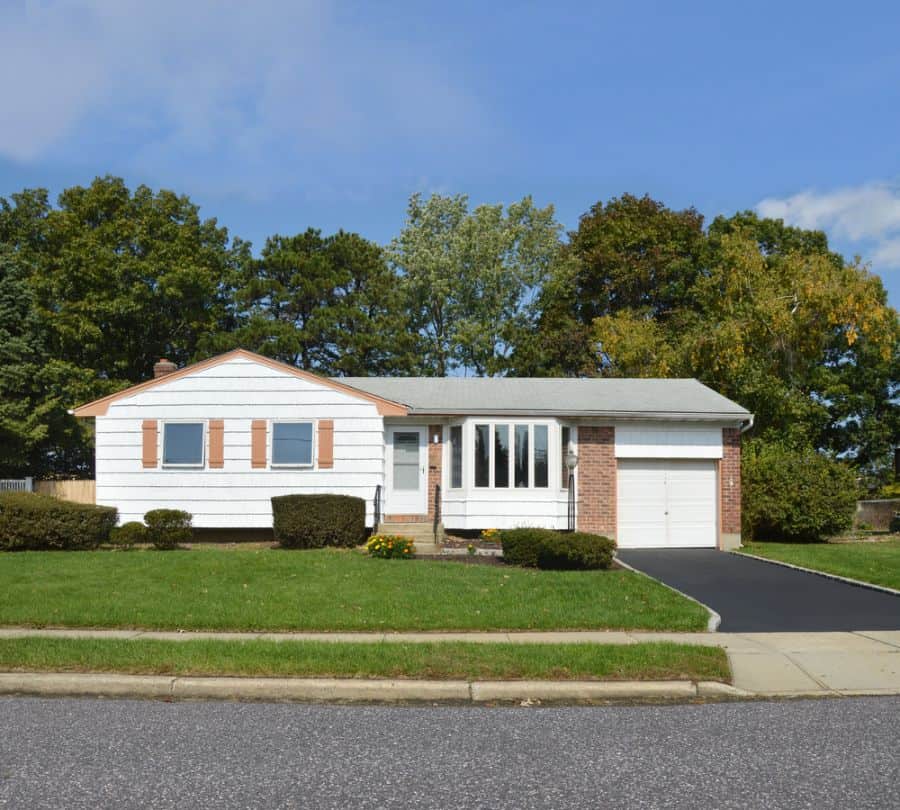 small ranch-style house with driveway