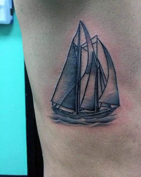 Small Ribs Mens Sailboat At Sea Tattoo