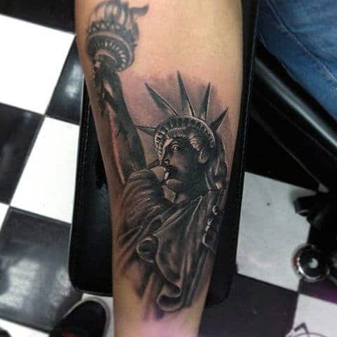 Small Shaded Statue Of Liberty Mens Tattoo On Forearm