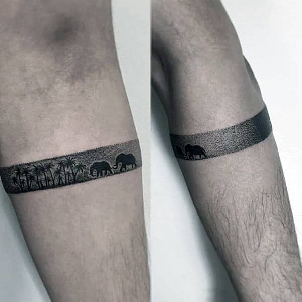 Small Simple Amband Tattoo On Male With Elephants And Palm Trees