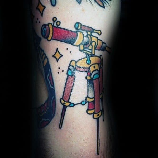 Vibrant tattoo of a telescope perched on a sturdy tripod