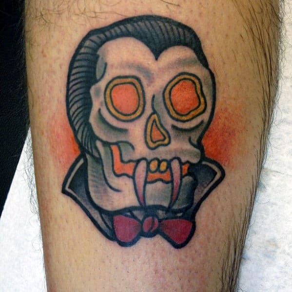 Small Simple Guys Traditional Dracula Vampire Fangs Tattoo On Leg