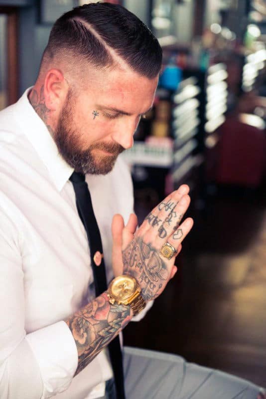 Small Simple Mens Face Cross Tattoos