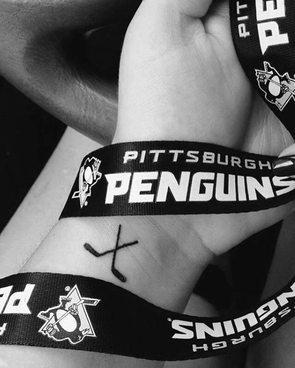 Small Simple Mens Hockey Sticks Wrist Tattoo