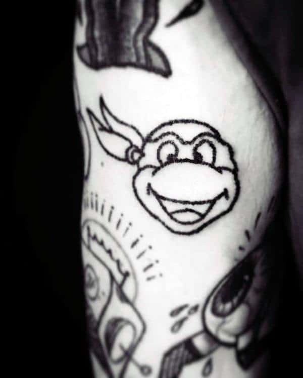 Small Simple Mens Teenage Mutant Ninja Turtle Head Tattoo On Arm With Black Ink Outline Design