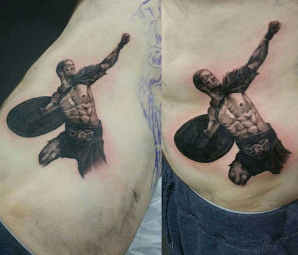 Detailed tattoo of a Spartan warrior with shield and sword on person's side torso