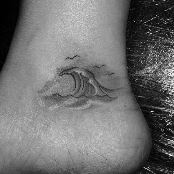 Small Simple Ocean Wave Water Tattoo For Men With Birds On Ankle Of Foot