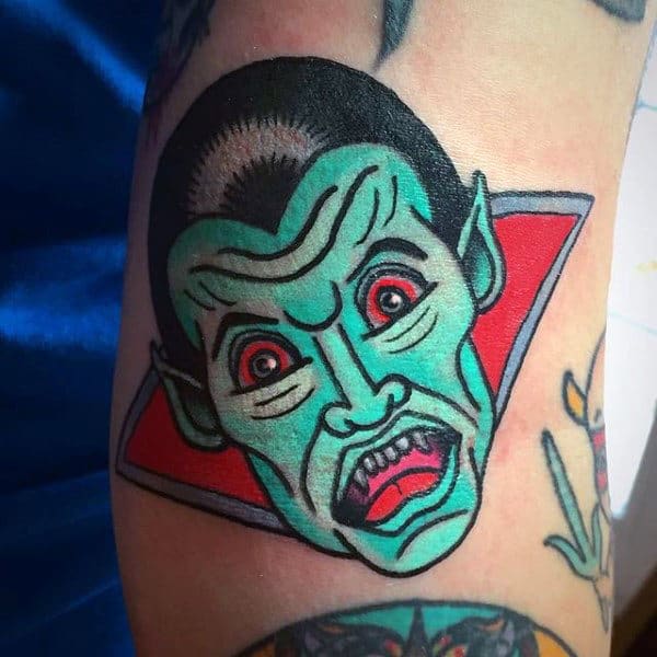 Small Simple Old School Mens Green And Red Vampire Tattoo On Arm