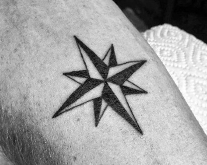 small-simple-star-nautical-mens-black-ink-inner-forearm-tattoo