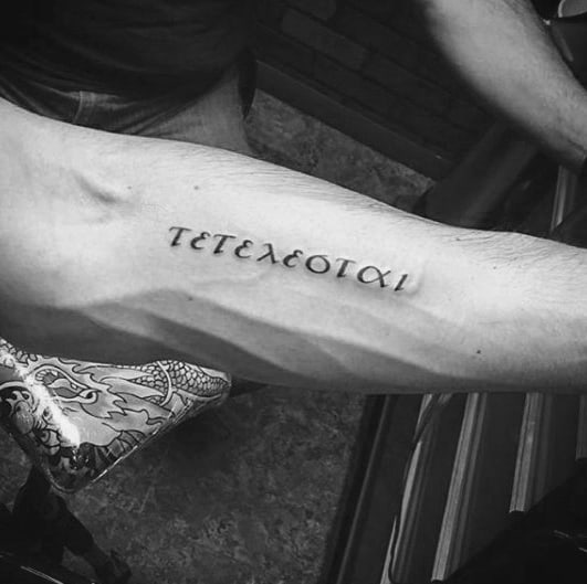 Small Simple Tetelestai Greek Mens Inner Forearm Tattoo