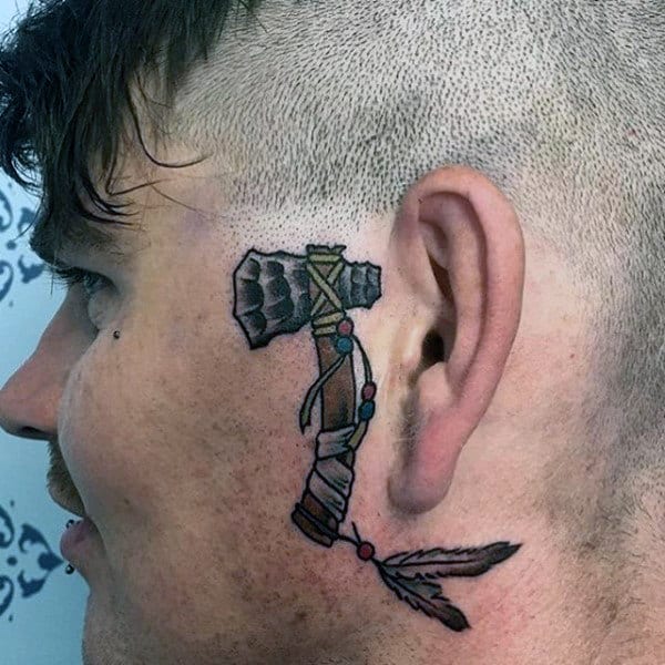 Small Simple Tomahawk Male Head Tattoo By The Ear