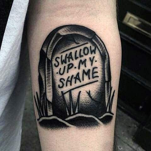 Small Simple Tombstone With Swallow Up My Shame Tattoo On Man