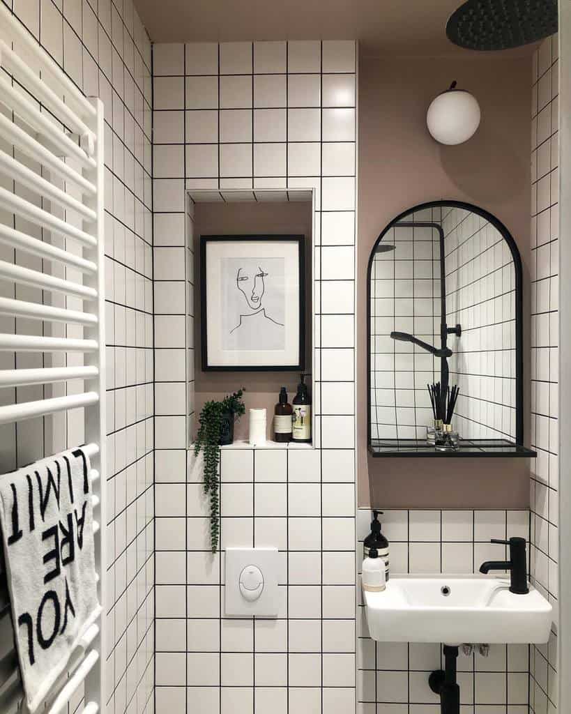 modern white tile bathroom with black accents