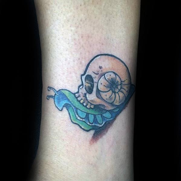 Small Skull Forearm Mens Tattoo Snail Design