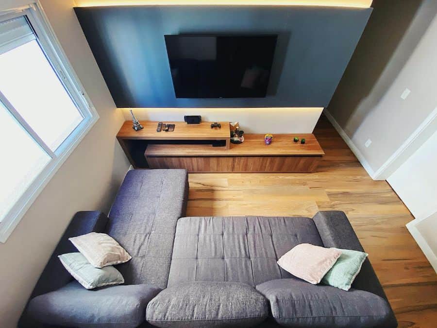 small tv room with gray sofa 