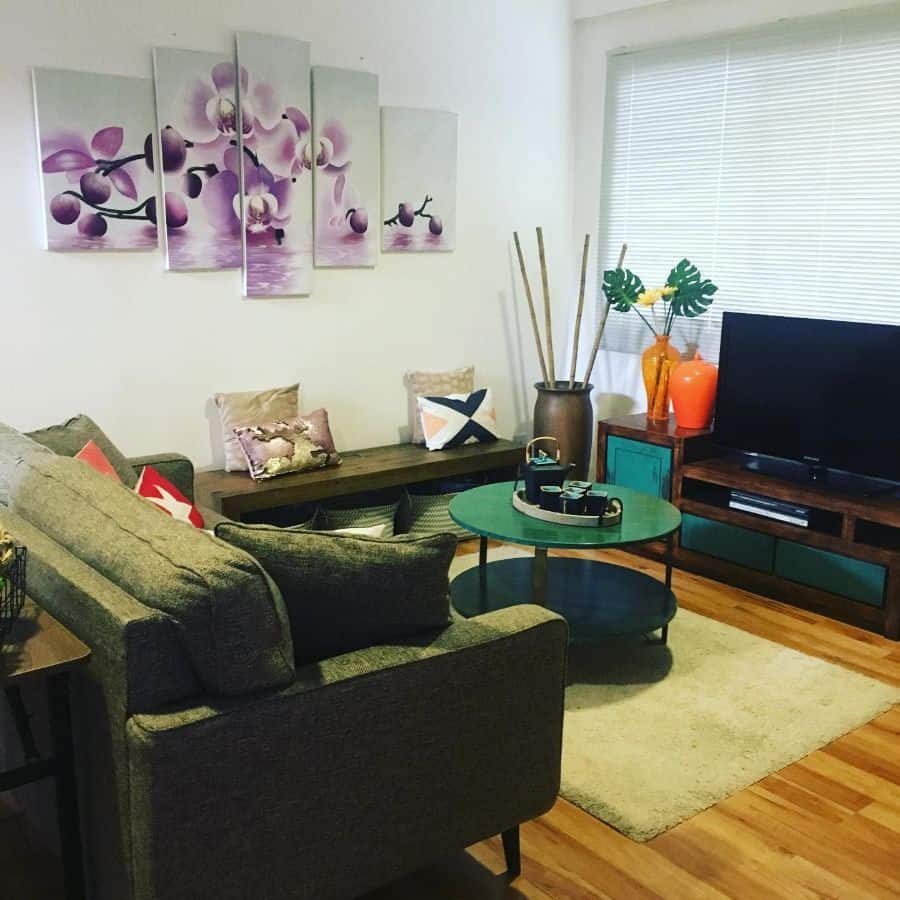 small tv room with floral wall art