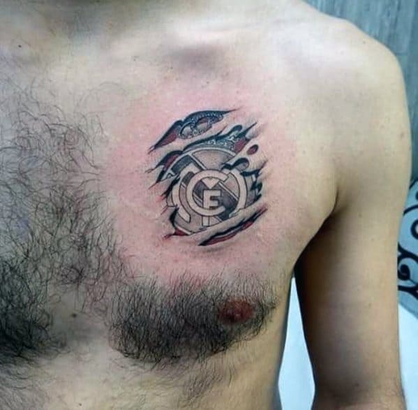 Small Upper Chest Ripped Skin Real Madrid Mens Tattoo Designs