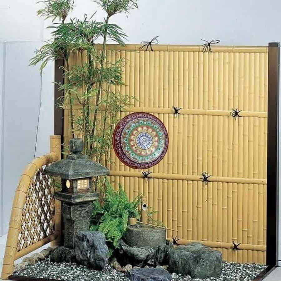 small corner garden bamboo fence stone temple statue 