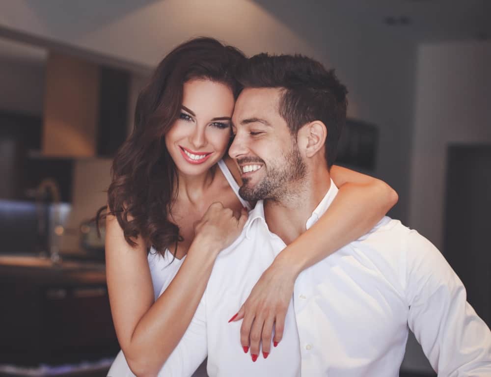 smiling couple woman embrance her man