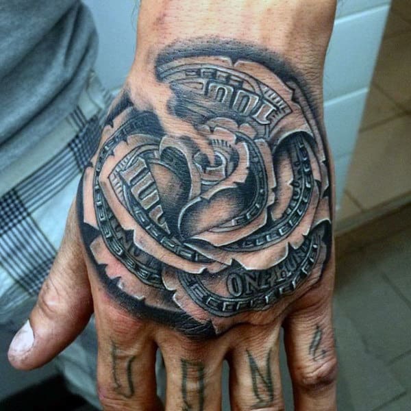 A black and gray shaded tattoo of a rose on the hand, featuring intricate money elements embedded within the petals, creating a bold and realistic effect