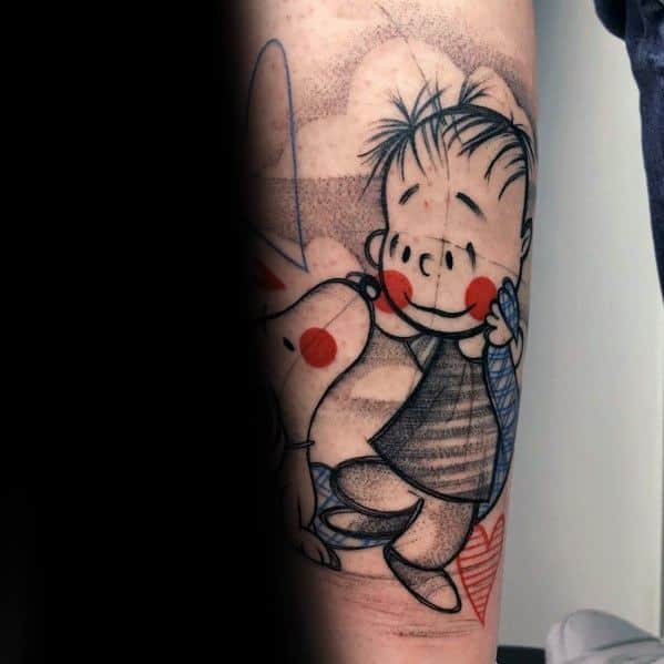 Colorful tattoo of Linus and Snoopy with red cheeks, featuring a soft shading style, placed on a person's arm.