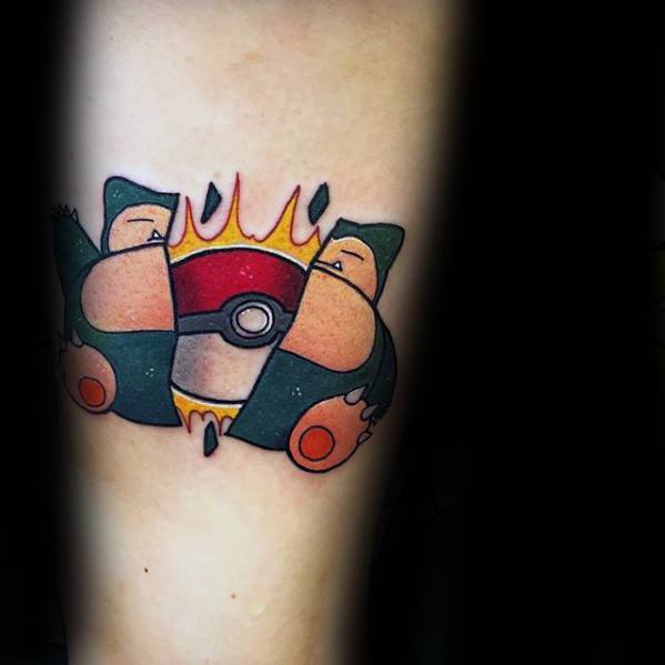 Creative Snorlax tattoo split in two, revealing a fiery Pokéball at the center with bold outlines and vibrant color.
