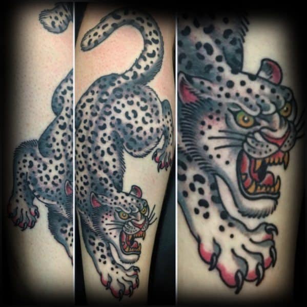 Traditional-style snow leopard tattoo in a dynamic crawling pose, featuring bold black spots, red claws, and a fierce yellow-eyed stare.