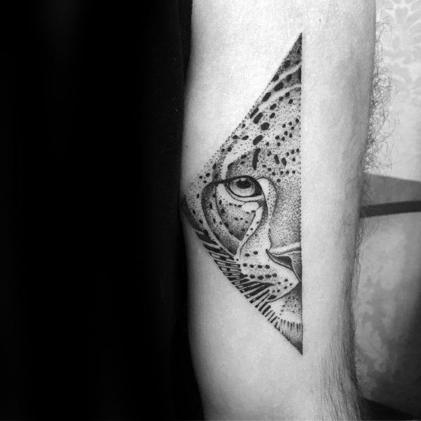 Geometric snow leopard tattoo featuring a detailed half-face within a triangle, using fine dotwork and clean lines for a modern look.