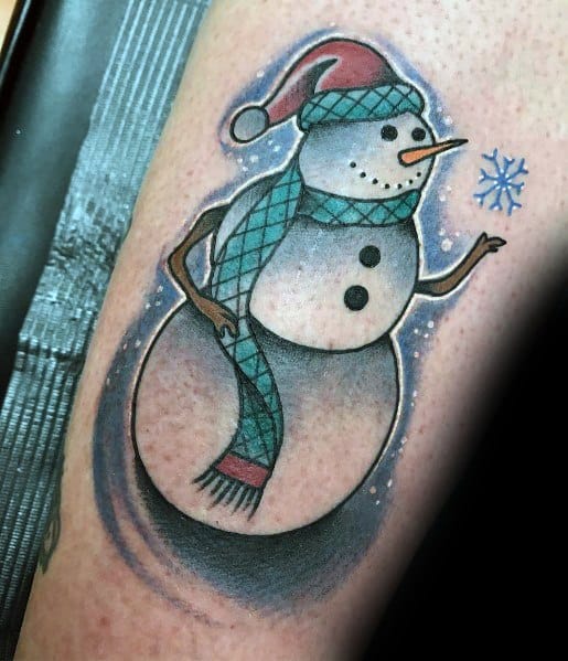 Charming snowman tattoo wearing a Santa hat and a blue scarf, holding a delicate snowflake, capturing a festive and wintery holiday vibe.