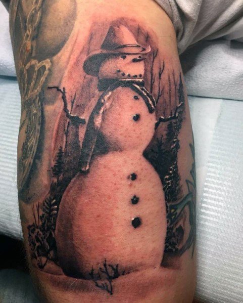 Realistic snowman tattoo with a cowboy hat and scarf, set in a dark winter landscape with eerie trees, blending rustic and mysterious elements.