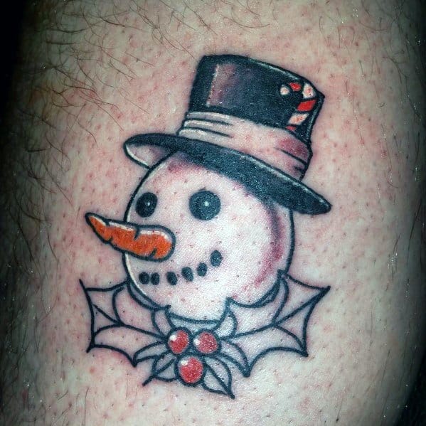 Festive snowman head tattoo with a top hat, carrot nose, and holly leaves with berries, combining classic winter charm with holiday spirit.