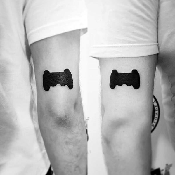 Solid Black Ink Back Of Arm Tricep Playstation Guys Tattoo Designs