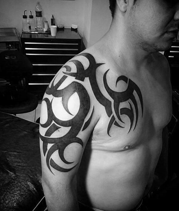 Solid Black Ink Tribal Shoulder Male Tattoo Ideas