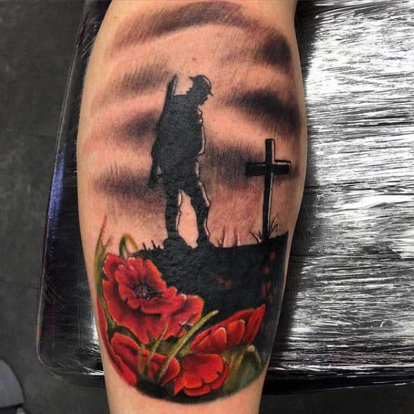 Solider Standing Over Grave Cross With Poppy Flowers Tattoo On Leg Calf Of Man