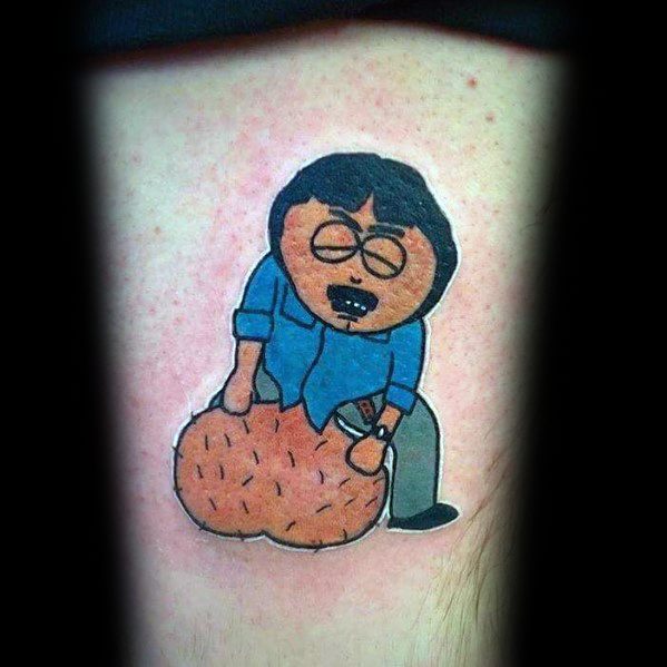 South Park tattoo of Randy Marsh sitting on his enlarged testicles, inspired by the show's humorous medical marijuana episode, with bold colors.