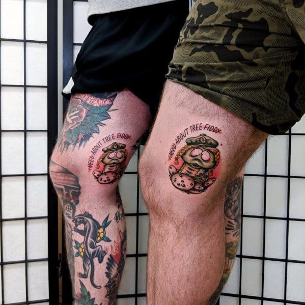 Matching South Park tattoos of Cartman as a hippie with 'Heard About Tree Fiddy?' text, featuring bold colors and playful shading.