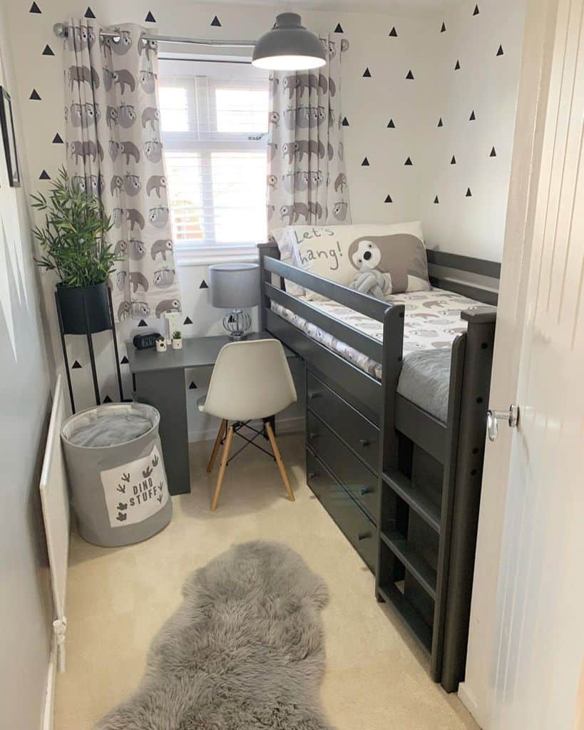 Kid's room with loft bed, under-bed storage, and playful decor.