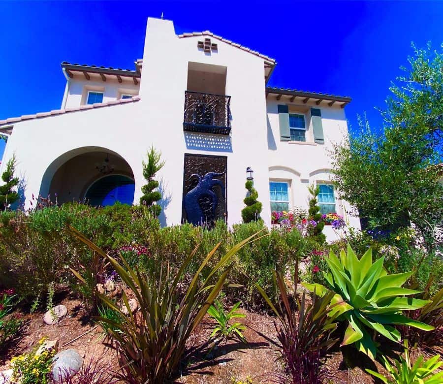 white spanish-style exterior front yard