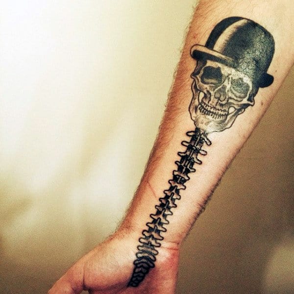 Spinal Cord With Skull Wearing Top Hat Tattoo For Guys On Wrist And Hand