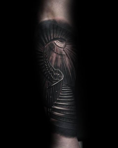 Realistic spiral staircase tattoo leading toward light, symbolizing mystery, ascension, and the journey to higher purpose or truth.