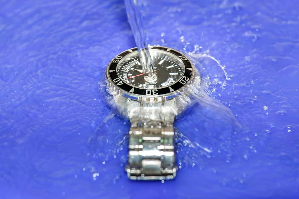 splashing water over waterproof hand watch