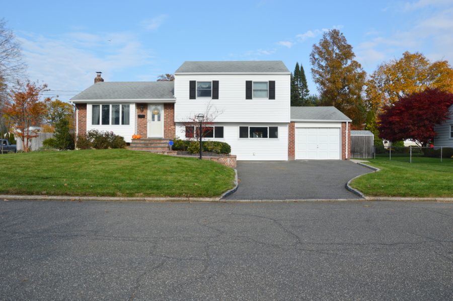 white exterior brick multi-level house