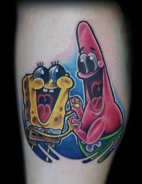 Vivid tattoo of SpongeBob and Patrick with wide eyes and excited expressions, captured in a playful and energetic pose on a colorful backdrop.