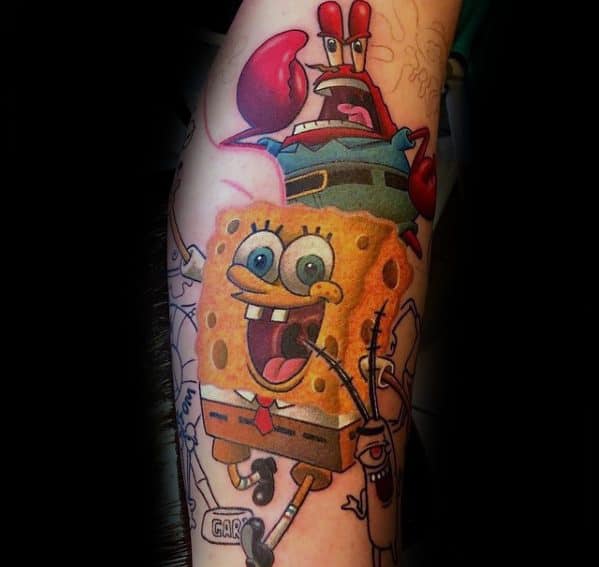 Colorful tattoo featuring SpongeBob joyfully holding a spatula, with Mr. Krabs above and Plankton below, surrounded by sketch-style outlines.