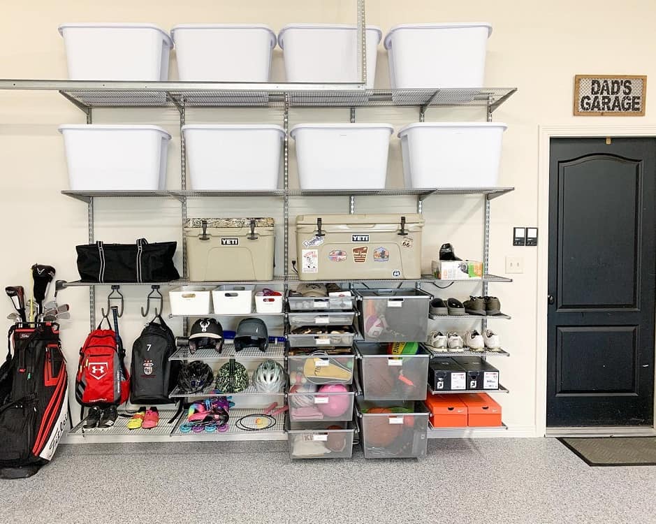 sports equipment garage storage white tubs gold clubs bike helmets black door