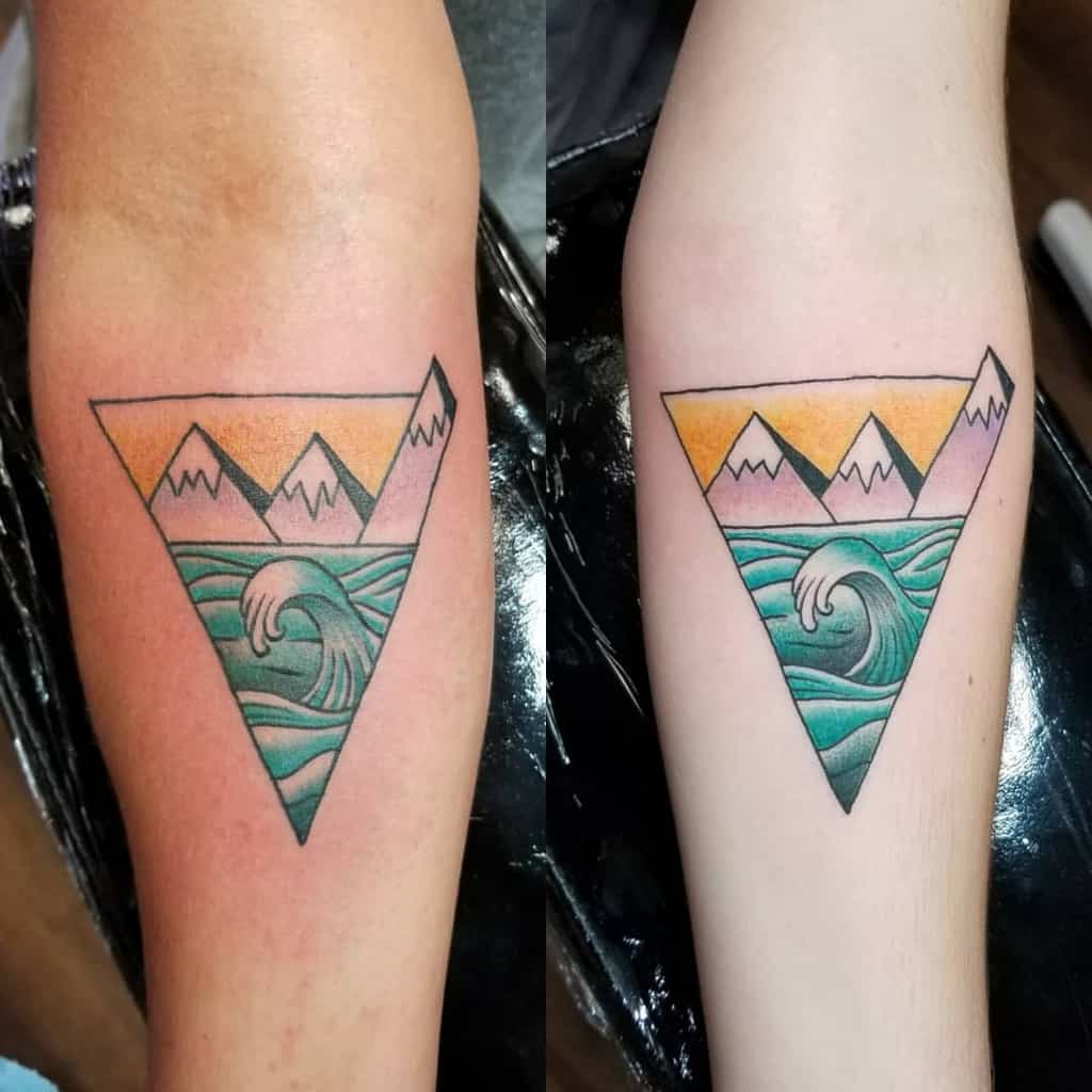 Matching mother-daughter tattoos of a sun and moon with intricate patterns
